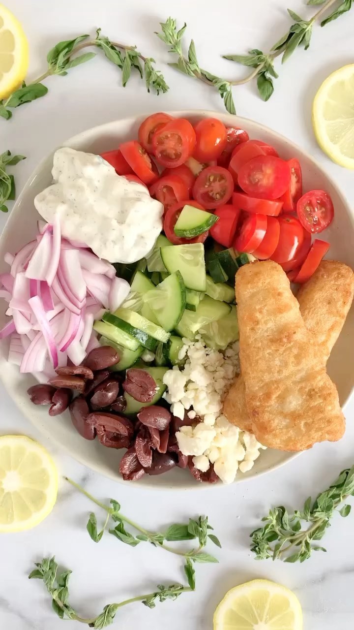 Cheers to summertime and this tasty Greek Salad with Fish Fillets! 🔥New Recipe Below⬇️

This is a quick easy-prep recipe that is a guaranteed crowd pleaser OR perfect for just you.

Keep these fish fillets on hand for #LightAndEasySeafood meals this summer.

Greek Salad with Fish Fillets for 1

Salad Ingredients:
▫️1 cup cucumber (I like to use English as they are less watery and seedy)
▫️3/4 cup tomatoes, sliced (I used cherry tomatoes)
▫️1/3 cup red onion, sliced 
▫️2 Tbsp kalamata olives 
▫️1 Tbsp feta cheese
▫️2 @gortonsseafood fish fillets (air fried 400°F 10 min)
▫️1/4 cup tzatziki sauce 

Dressing: 
▫️1/2 tbsp extra virgin olive oil
▫️1/2 tsbp lemon juice 
▫️1/2 tbsp vinegar 
▫️1/6 garlic powder 
▫️1/8 tsp oregano 
▫️Add some lemon zest if you are feeling extra!😉

Add cucumber, tomato, onion, and olives to a bowl. In a small bowl, whisk together dressing ingredients. Pour dressing over veggies and lightly combine. Top with cooked fish, feta, and tzatziki sauce. Enjoy!

#GortonsPartner

#dinnerrecipes #greeksalad #summersalad #wildcaught #sustainableseafood #summersalads #dinnerisserved #saladideas #airfryerrecipes #fishfordinner #dinnerinspo #whatsonmyplate #fishfillet #familyfood #familyfoodie #fishfillets #healthydinners #healthydinnerideas #airfryerrecipe #foodieheaven #healthyeats #healthyishfood #cookit #makeitdelicious #familyfoodie #shareyourtable  #sammisrecipes #eattherainbow🌈