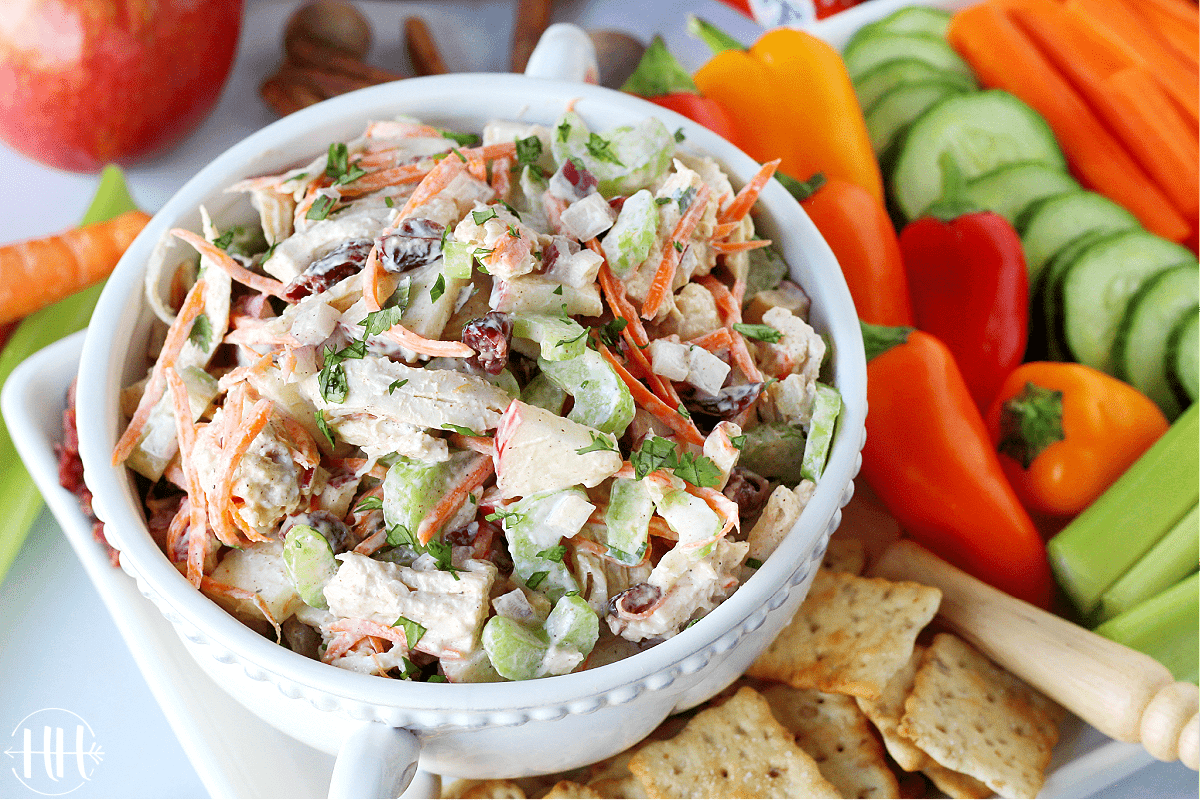 Pretty tray of autumn spiced turkey salad and bell peppers and crackers.