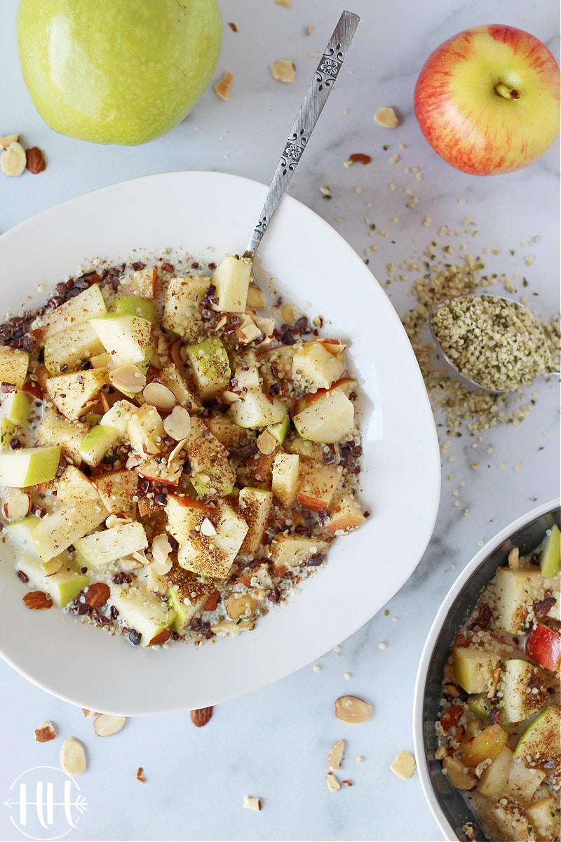 Vegan Apple Cereal Recipe | This clean eating little gem is perfect for a healthy breakfast, dairy free dessert, or a gluten free snack. Enjoy crunchy apples and seeds (hemp seeds, ground flaxseed, cacao nibs) and sliced almonds together. Use whatever nuts, seeds, or milk (almond milk, cashew milk, homemade oat milk) that you have on hand. This apple cereal bowl is vegetarian, grain free, sugar free, and Paleo friendly. Homemade cereal at it's best with only whole food ingredients!