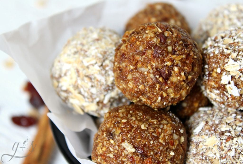 Up close photo of a stack of no bake chocolate chip pumpkin balls.