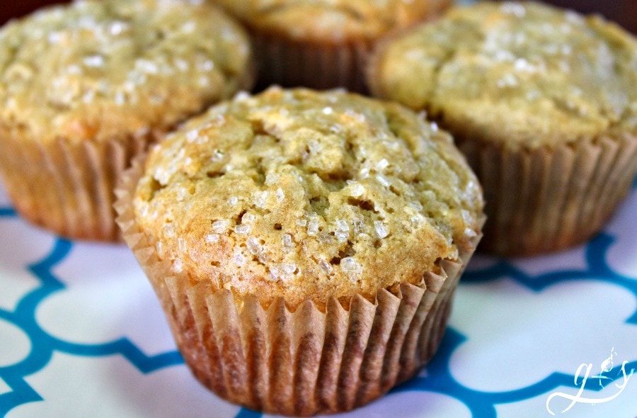 Pretty banana muffins on a blue and white plate. 