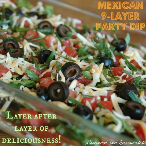 Need an easy, healthy and fun dish to take to your next potluck or party? This 9- Layer Mexican Party Dip does not disappoint with it’s fresh and bold flavors. Who doesn’t love layers of fresh ingredients piled high? This dip will be the hit of your next get together. Guaranteed. | groundedandsurrounded.com
