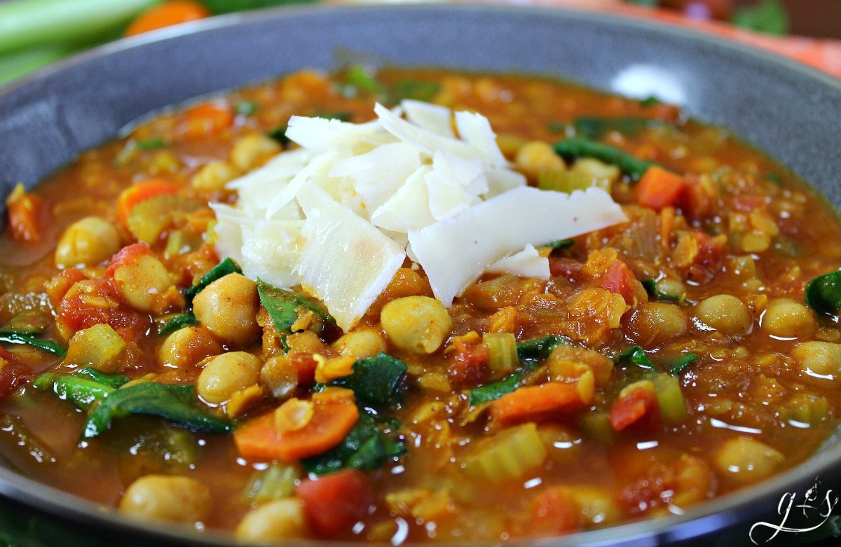 This quick vegetarian dinner recipe is full of bold and unique flavors- perfect for a "Meatless Monday"! Make this vegetarian by using vegetable stock with the lentils and chickpeas. Go a step further and make it vegan by omitting the butter. Despite the lengthy list of ingredients, this healthy soup really comes together quickly! We love that this gluten free whole food recipe is packed full of protein, and leaves you feeling full and satisfied!