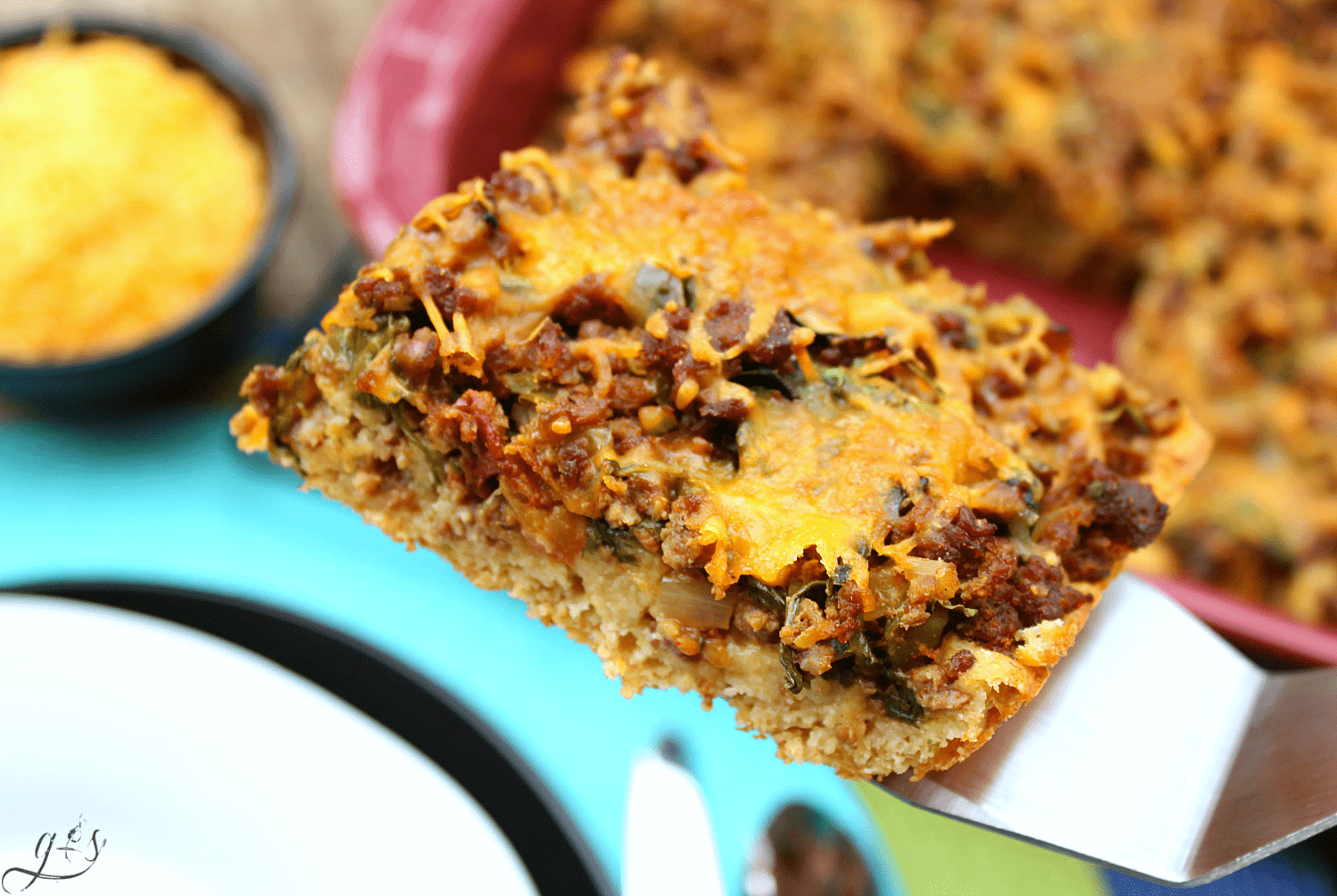 The BEST Clean Eating Mexican Cornbread Casserole | This healthy, easy, and gluten-free recipe contains no processed ingredients and TONS of veggies aka WHOLE FOODS like onion, spinach, bell pepper, and salsa! It can be made with ground beef or any other meat such as buffalo, venison, or ground turkey. If you are looking for a new from scratch homemade family meal this one's for you! 