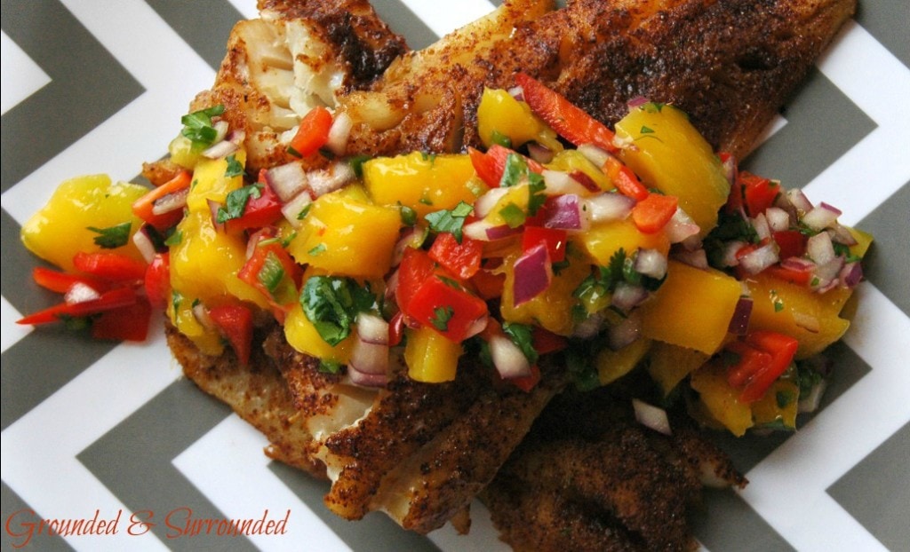 This healthy grilled cod with colorful mango salsa comes together SO quickly! Aren't easy weeknight meals the best? The smokey spiciness of the fish paired with the sweet yet tangy salsa is a flavor explosion! This simple, gluten-free, and clean-eating recipe is sure to impress. Who says healthy food is boring?! Not us! https://happihomemade.com/recipe/blackened-cod-with-mango-salsa/