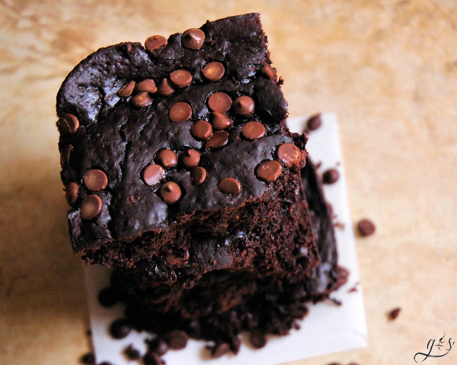Secretly Skinny Double Chocolate Brownies | This easy gluten free and refined sugar free brownie is every bit as indulgent and healthy as they sound! At less than 100 calories per homemade brownie, you will not feel guilty indulging in these! They are definitely the real deal with their fudgey texture and from scratch ingredients. Dare I say the best low calorie brownies EVER! 