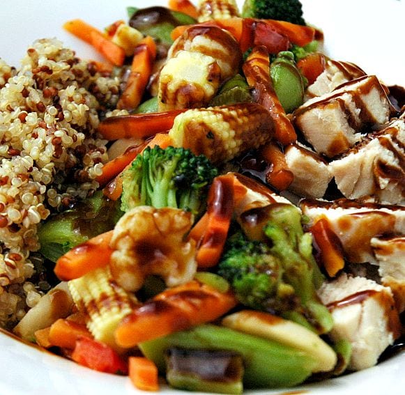 Tri color quinoa, teriyaki vegetables, and chicken breast with a teriyaki glaze.