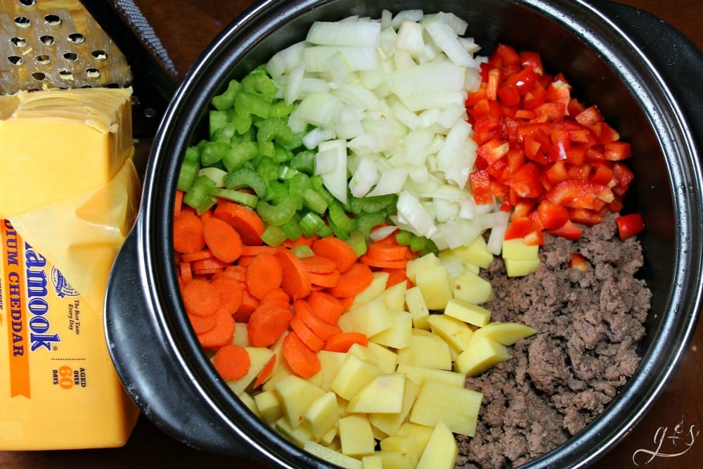 All the ingredients in a black soup pot to make a healthy recipe. 
