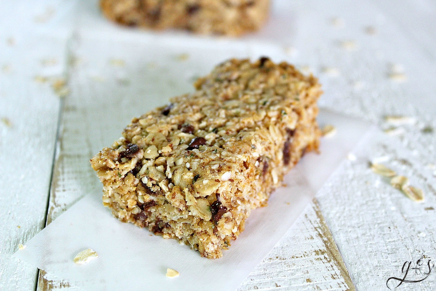 These Fit & Frugal Granola Bars are made with healthy gluten free ingredients to create chewy granola bars you feel good about feeding your kids. This homemade recipe is a perfect snack or addition to any school lunch. They are packed with superfoods like ground flax seeds, hemp seeds and coconut! But any add-ins will work! We never skip the chocolate chips but the possibilities are endless. Look no further, you have found the BEST granola bar recipe on Pinterest!