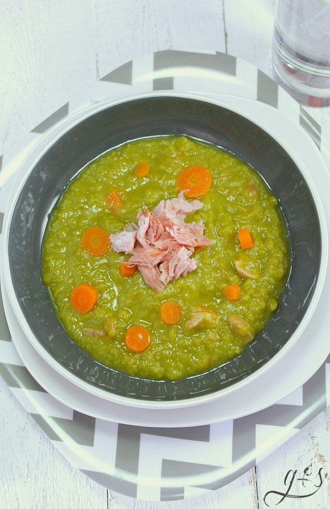 Simply the BEST Split Pea Soup- an easy and healthy stove top meal recipe that uses leftover ham or turkey bacon along with tons of clean eating vegetables and stock. Make it vegetarian or vegan by using vegetable broth and omitting the meat. This creamy, hearty, and classic homemade soup is simple to prepare and has been a family favorite of ours for years! 