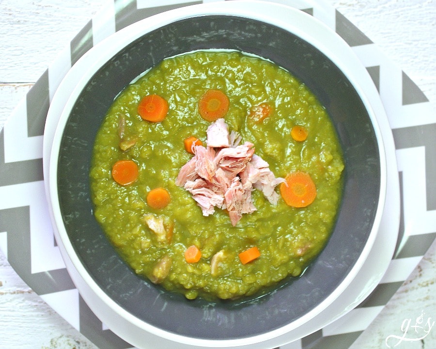 Simply the BEST Split Pea Soup- an easy and healthy stove top meal recipe that uses leftover ham or turkey bacon along with tons of clean eating vegetables and stock. Make it vegetarian or vegan by using vegetable broth and omitting the meat. This creamy, hearty, and classic homemade soup is simple to prepare and has been a family favorite of ours for years!