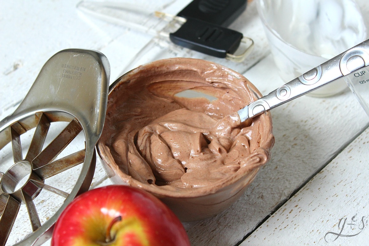Clean Eating Chocolate Fruit Dip mixed together with a spoon.