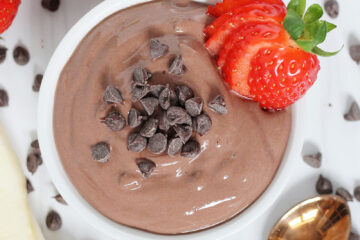 Overhead photo of healthy chocolate fruit dip topped with mini chocolate chips.