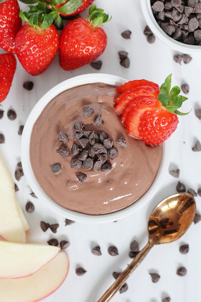 Overhead photo of healthy chocolate fruit dip topped with mini chocolate chips.