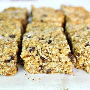 These Fit & Frugal Granola Bars are made with healthy gluten free ingredients to create chewy granola bars you feel good about feeding your kids. This homemade recipe is a perfect snack or addition to any school lunch. They are packed with superfoods like ground flax seeds, hemp seeds and coconut! But any add-ins will work! We never skip the chocolate chips but the possibilities are endless. Look no further, you have found the BEST granola bar recipe on Pinterest!