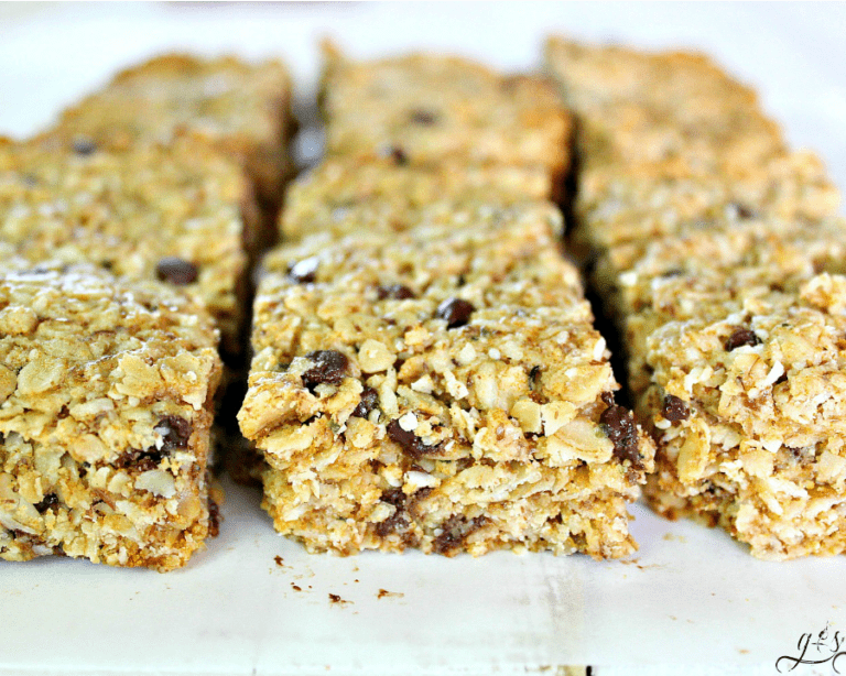 These Fit & Frugal Granola Bars are made with healthy gluten free ingredients to create chewy granola bars you feel good about feeding your kids. This homemade recipe is a perfect snack or addition to any school lunch. They are packed with superfoods like ground flax seeds, hemp seeds and coconut! But any add-ins will work! We never skip the chocolate chips but the possibilities are endless. Look no further, you have found the BEST granola bar recipe on Pinterest!