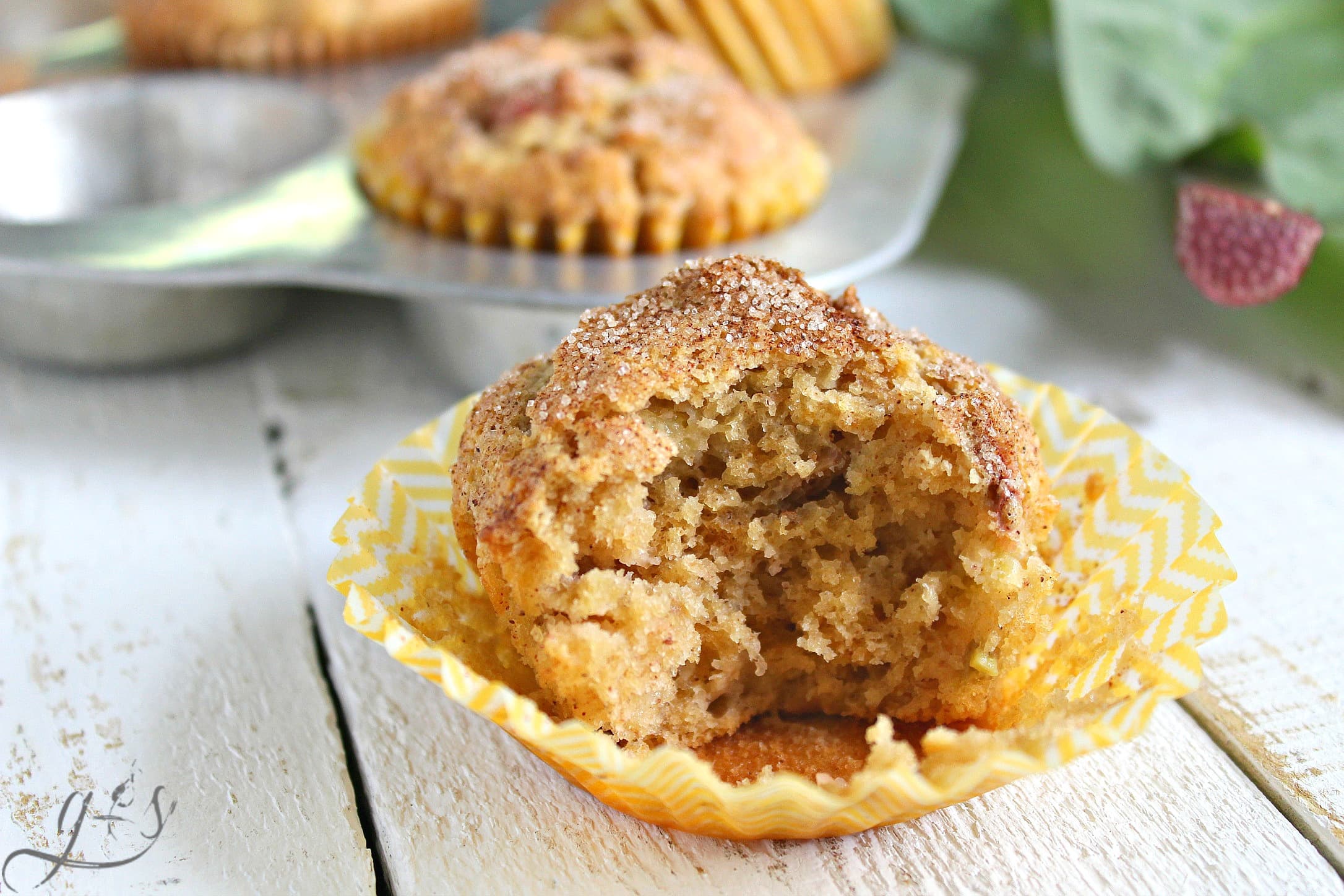 The BEST Gluten-Free Sour Cream Rhubarb Muffins | This easy and healthy breakfast or brunch recipe uses gluten-free flour, but don't let that scare you off. They can be made with whole wheat pastry flour and still retain their light and soft texture. The batter contains coconut oil and applesauce along with other real food ingredients and is topped with the perfect mixture of cinnamon-sugar. These also freeze well! 
