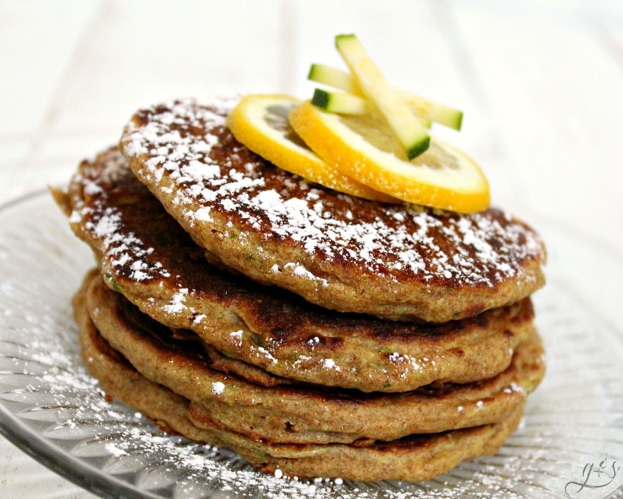  The Best Lemon Zucchini Pancakes | This delicious recipe is perfect for an easy school day breakfast for the kids. These simple from scratch flapjacks are just what you need to make your morning easy. Try freezing half the batch of these healthy, homemade, & whole wheat pancakes to eat later. The combination of healthy zucchini and fresh lemon create a sweet and easy pancake perfect for any family meal!