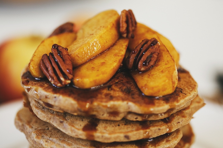 Tall stack of Apple Buckwheat Pancakes with Coconut Caramel Apples from Cocoon Cooks.