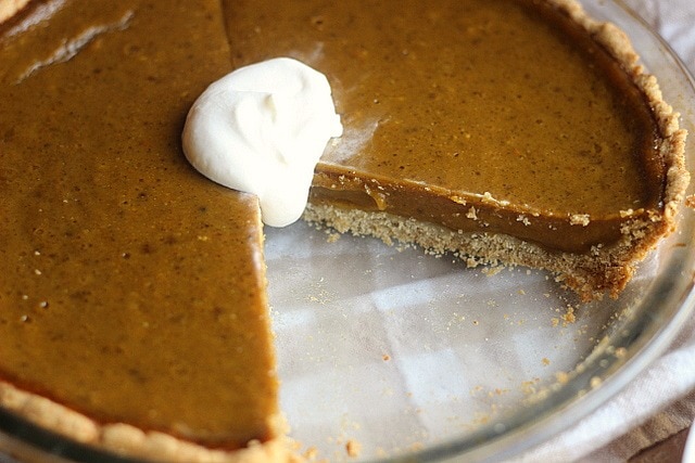 Clean eating fall recipes are easy to find in this article take this pie for example. A gluten free Clean Honey Pumpkin Pie from Oatmeal with Fork with a dollop of whipped cream. 