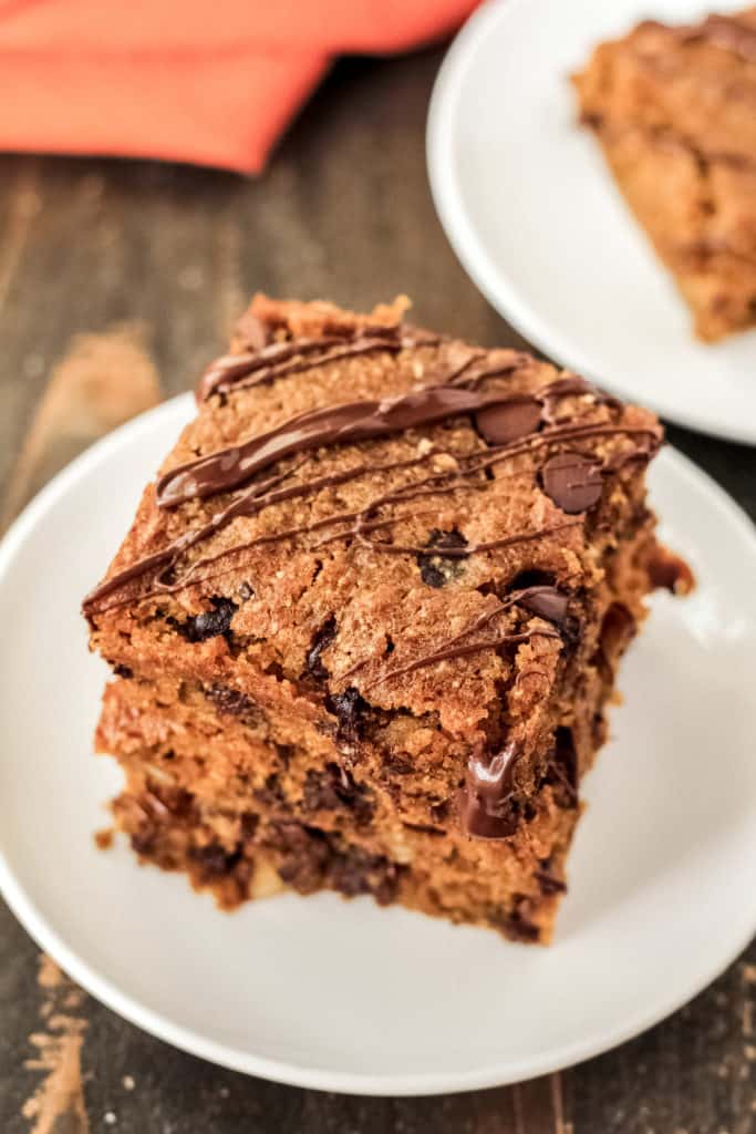 A stack of Pumpkin Chocolate Chip Oat Bars by Chelsea at MileHighMitts.com