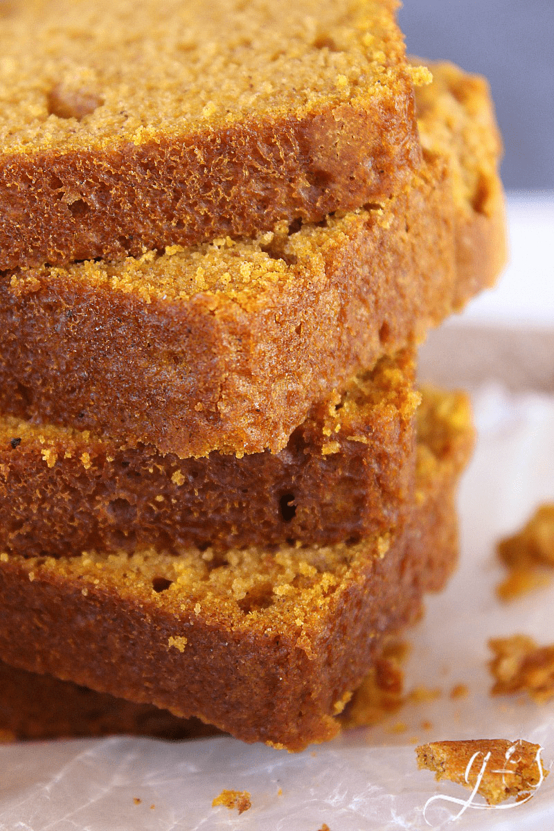 Thick slices of Grandma's Pumpkin Bread Recipe stacked high.
