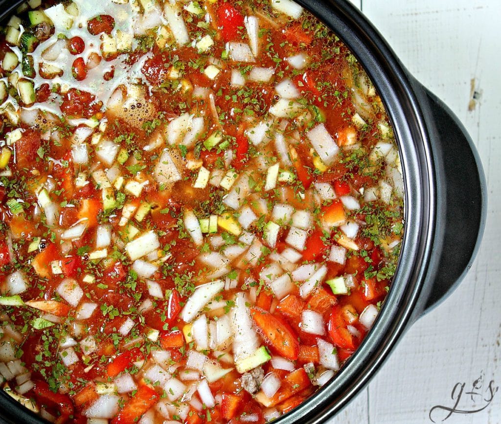 Beautiful shot of an easy soup ready to simmer! You can see all the seasonings and chopped vegetables.