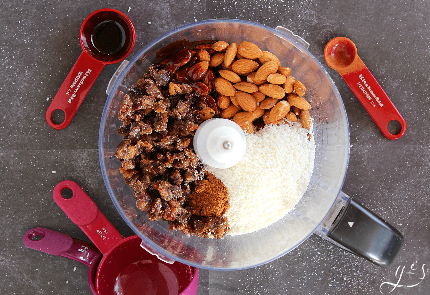 All the ingredients in a food processor to make vegan bliss bites for Christmas.