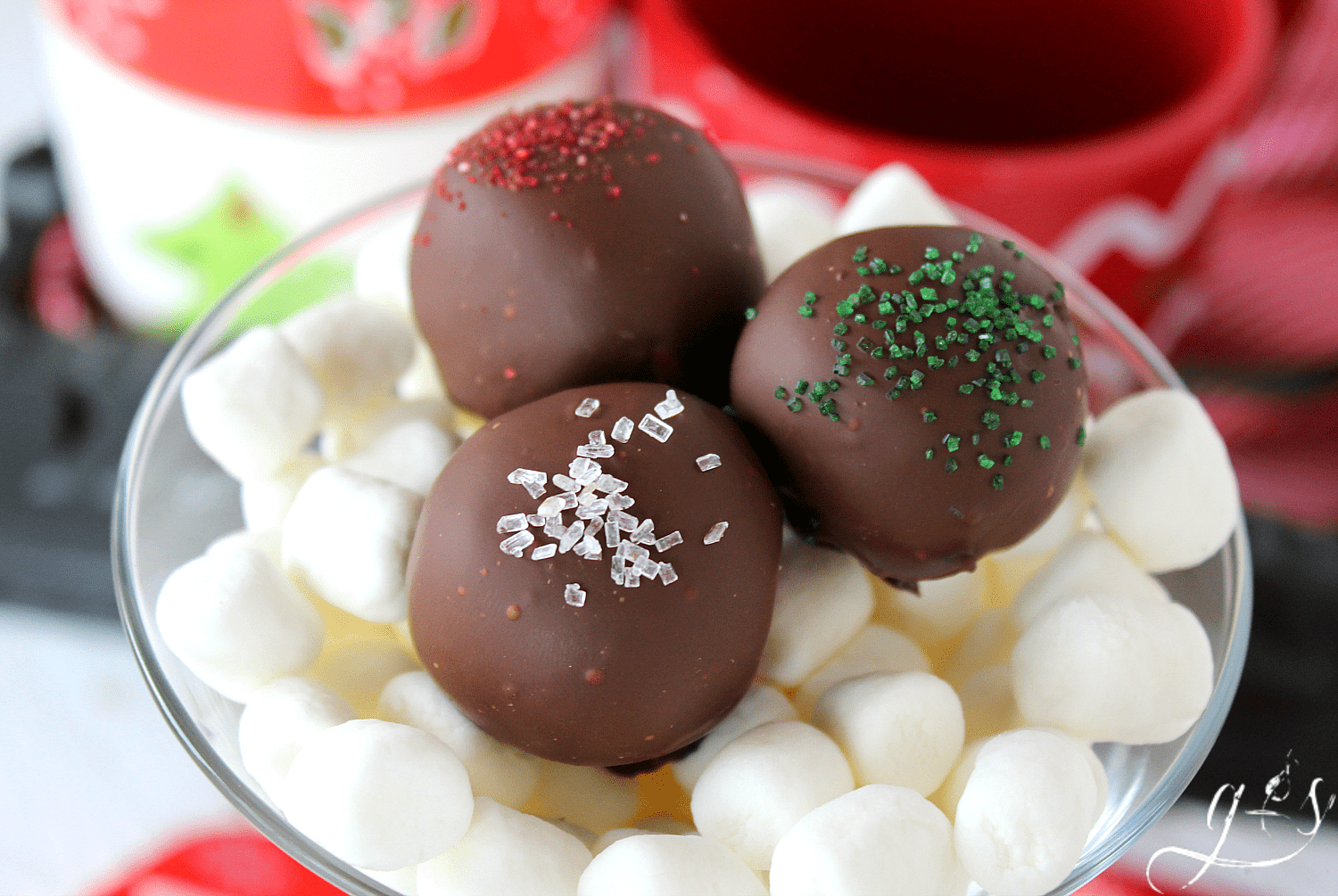 A cup full of holiday truffles.