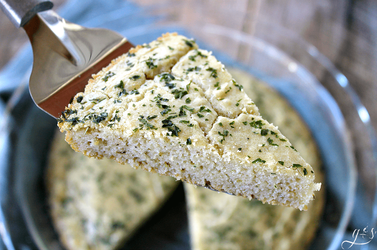 The BEST Gluten Free Focaccia Bread | This healthy and easy recipe is perfect alongside a soup or as an appetizer dipped in olive oil! The addition of rosemary and garlic make this delicious side dish a keeper. It isn't easy to find homemade and clean eating in a bread, but this one delivers! The tapioca flour, coconut flour, and eggs make this a low carb option as well as grain and dairy free.
