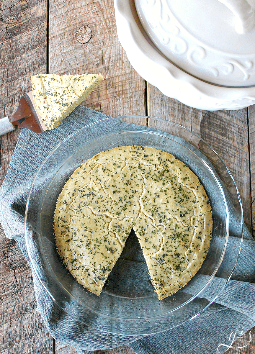 The BEST Gluten Free Focaccia Bread | This healthy and easy recipe is perfect alongside a soup or as an appetizer dipped in olive oil! The addition of rosemary and garlic make this delicious side dish a keeper. It isn't easy to find homemade and clean eating in a bread, but this one delivers! The tapioca flour, coconut flour, and eggs make this a low carb option as well as grain and dairy free.