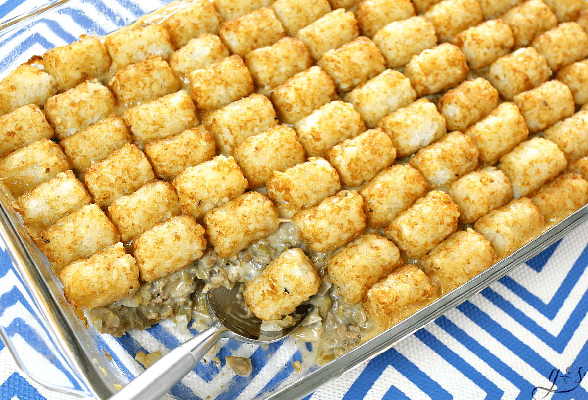 The BEST Gluten-Free Tater Tot Casserole | This easy original recipe will quickly become your family's favorite meal! Only 10 simple ingredients like ground beef, milk, green beans, and tater tots combine into a gluten-free recipe that is more healthy than the cream soup variety. Lightened up comfort foods can taste delicious! Let's feed our families dinners and dishes that offer more nutrition while still saving money and living a frugal lifestyle.