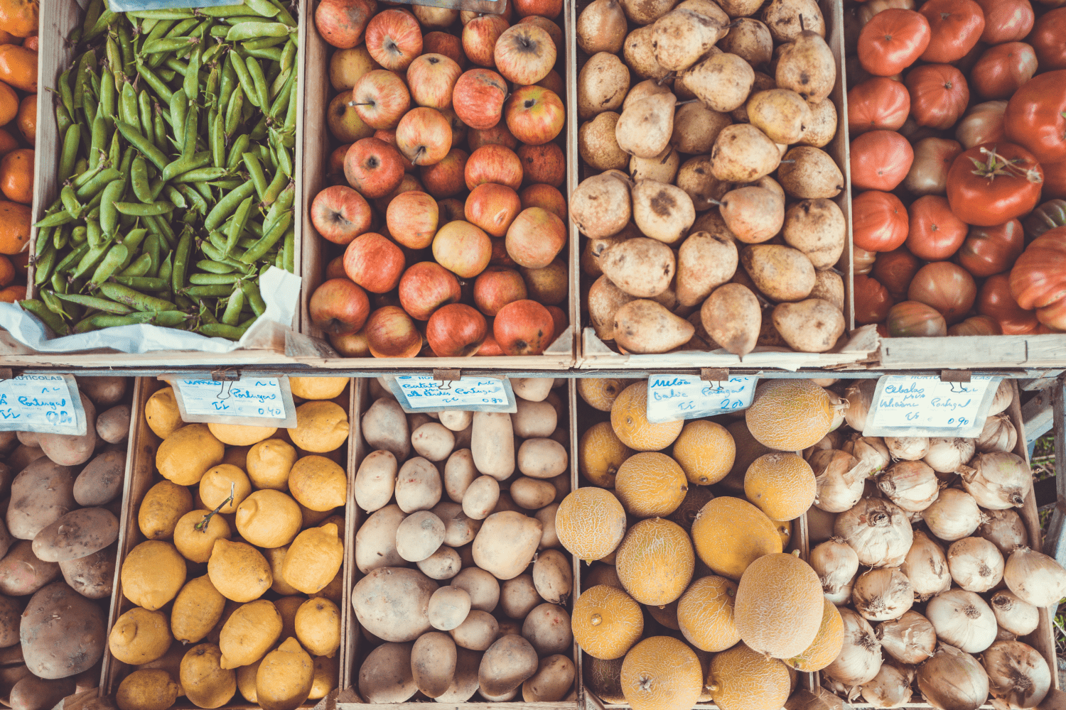 A market with bins full of fresh produce is where to go to learn how to eat more whole foods. 