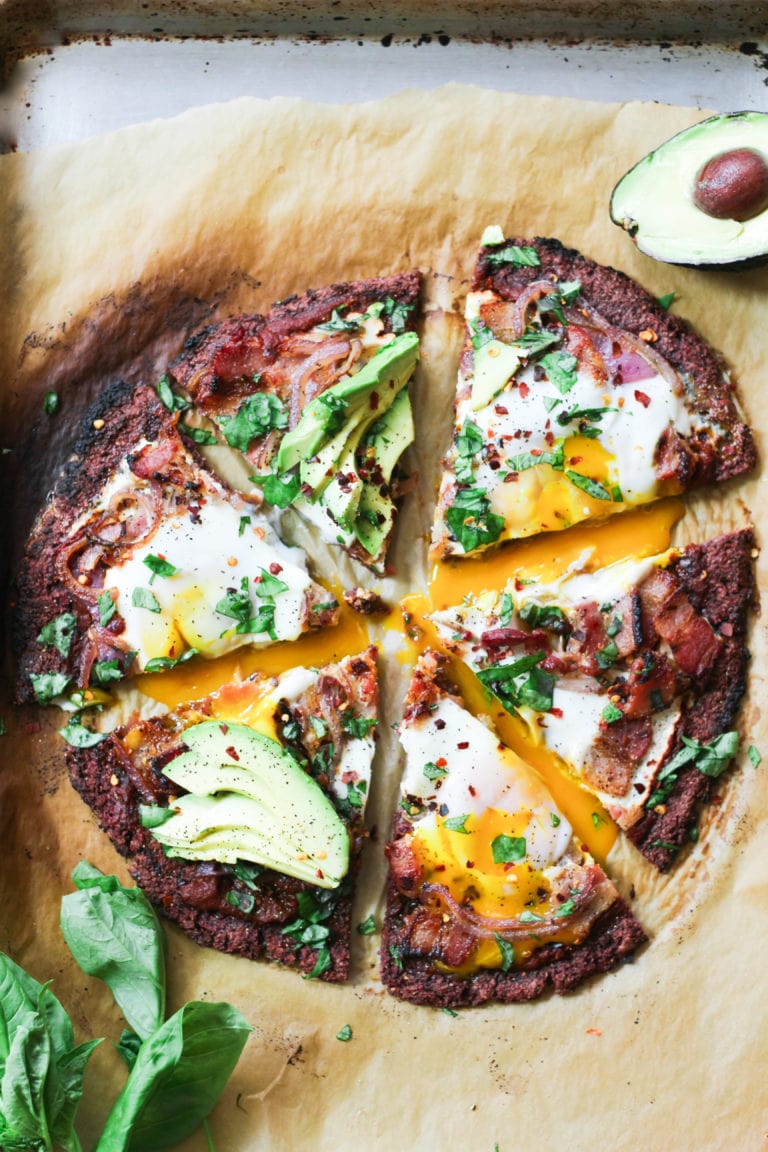 Paleo breakfast pizza cut into triangles.