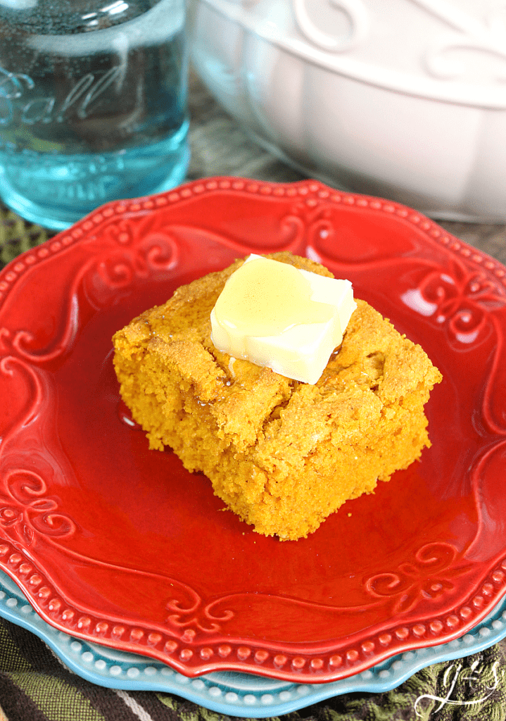 The BEST Gluten Free Pumpkin Cornbread | This easy and sweet clean eating recipe will make all your dreams come true this fall! Top this healthy side dish with butter, honey, or maple syrup. Serve alongside soup, chili, or stew for a comforting and skinny meal. You can easily make this batter into muffins too! 