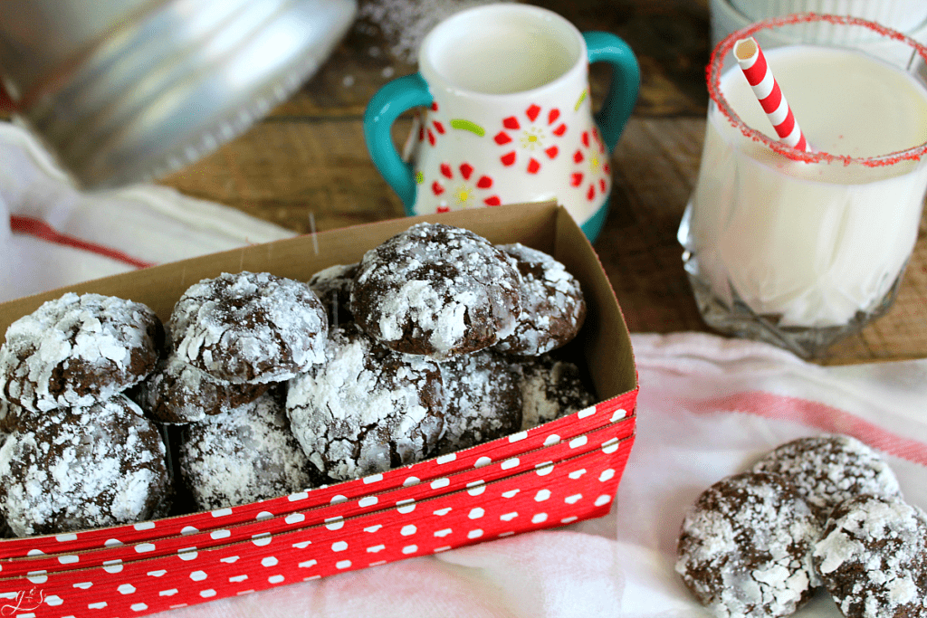 Cute red polka dot container full of gluten free chocolate crinkle cookies.