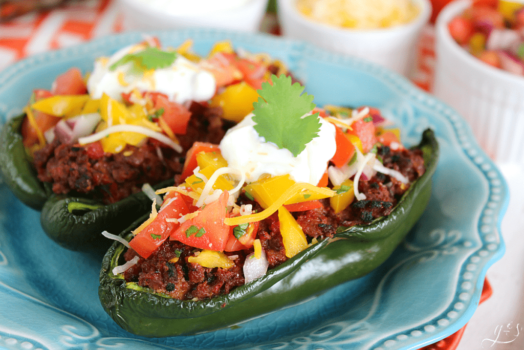 Up close shot of hot peppers stuffed with ground meat.