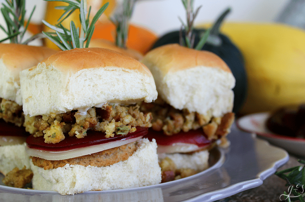 The BEST Thanksgiving Leftover Sliders | Whether you want to enjoy all the flavors of Thanksgiving with leftovers on Black Friday or enjoy this recipe in the summer, I've got you covered. Use a turkey burger or leftover turkey, stuffing, provolone cheese, cranberry sauce, and mayo. Add mashed potatoes and gravy too! This is the best warm sandwich to enjoy with friends, family, and the kids! #holidays #burgers #leftovers