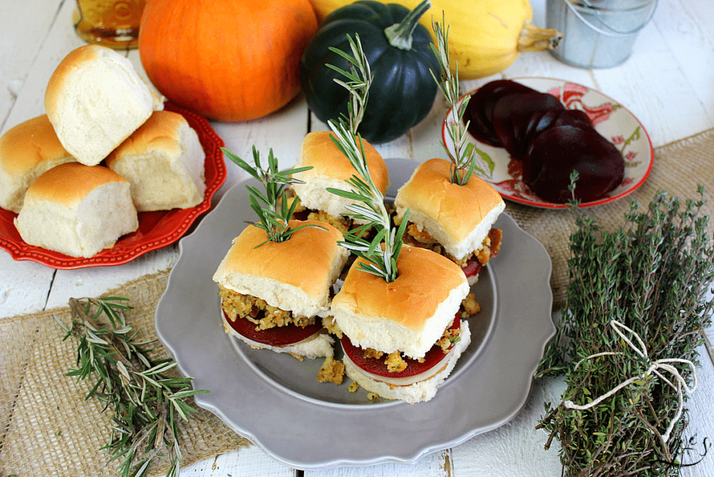 The BEST Thanksgiving Leftover Sliders | Whether you want to enjoy all the flavors of Thanksgiving with leftovers on Black Friday or enjoy this recipe in the summer, I've got you covered. Use a turkey burger or leftover turkey, stuffing, provolone cheese, cranberry sauce, and mayo. Add mashed potatoes and gravy too! This is the best warm sandwich to enjoy with friends, family, and the kids! #holidays #burgers #leftovers