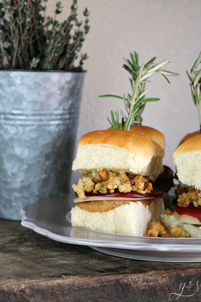 The BEST Thanksgiving Leftover Sliders | Whether you want to enjoy all the flavors of Thanksgiving with leftovers on Black Friday or enjoy this recipe in the summer, I've got you covered. Use a turkey burger or leftover turkey, stuffing, provolone cheese, cranberry sauce, and mayo. Add mashed potatoes and gravy too! This is the best warm sandwich to enjoy with friends, family, and the kids! #holidays #burgers #leftovers