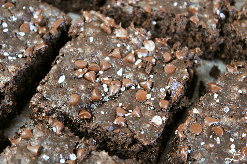 Delicious dark chocolate brownies topped with mini chocolate chips and flaked sea salt. 