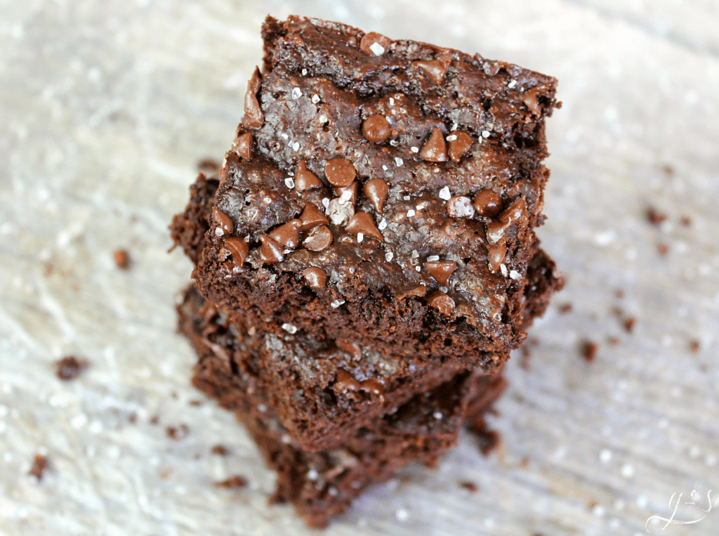 Skinny Salted Brownies stacked high and ready to eat. 