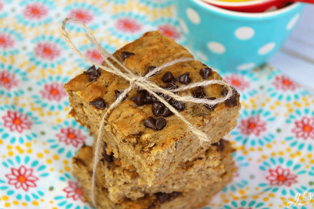 Banana Bread Blondies stacked 3 high with a string tied in a bow around them.