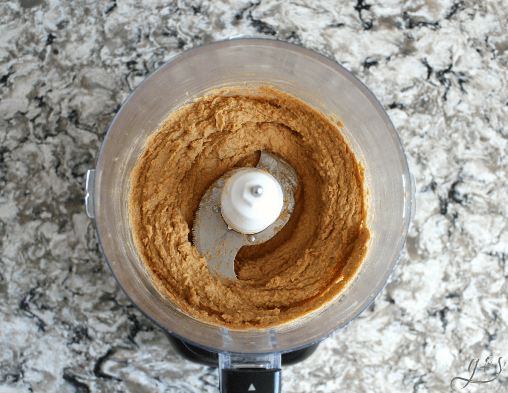 Healthy and creamy dessert hummus blended in food processor. 