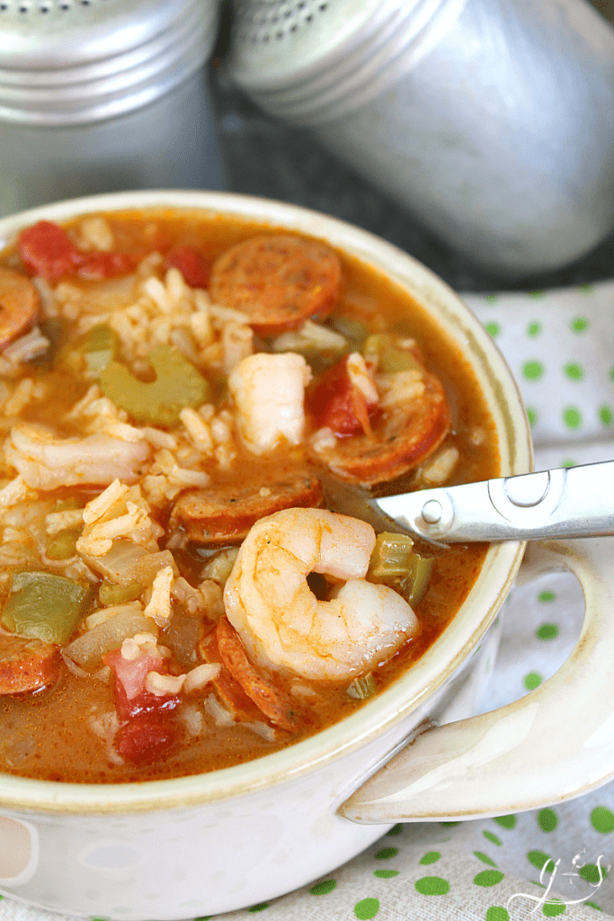 Spoon in a large bowl of healthy gumbo jambalaya.