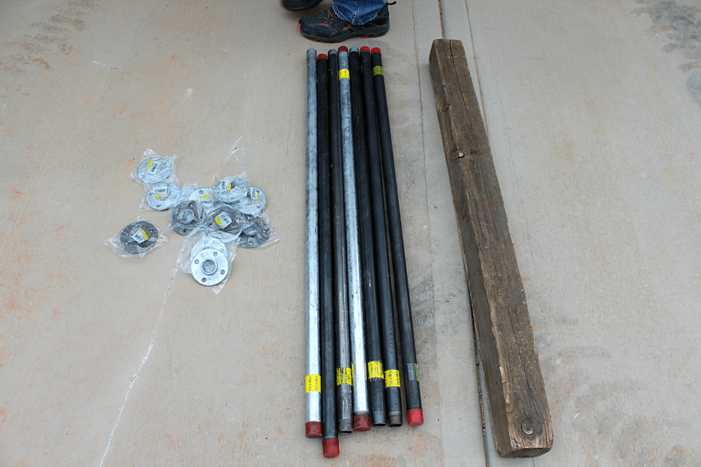 Flanges, steel pipe, and posts to make rustic stair banister.