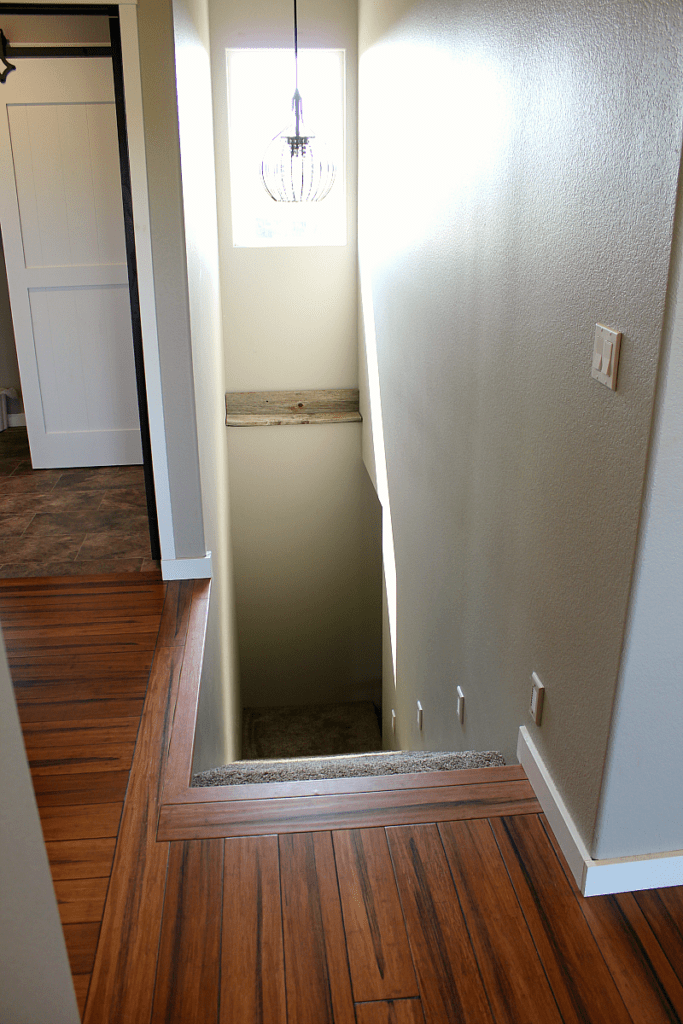 Looking down a stairwell that is without an industrial banister or railings.