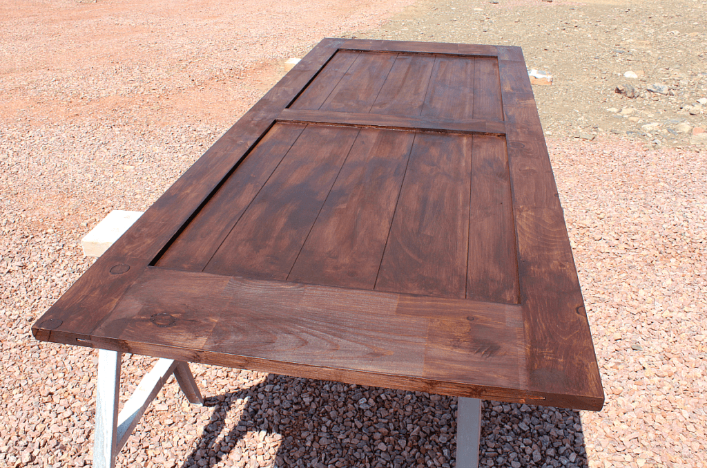 first coat of walnut gel stain on barn door