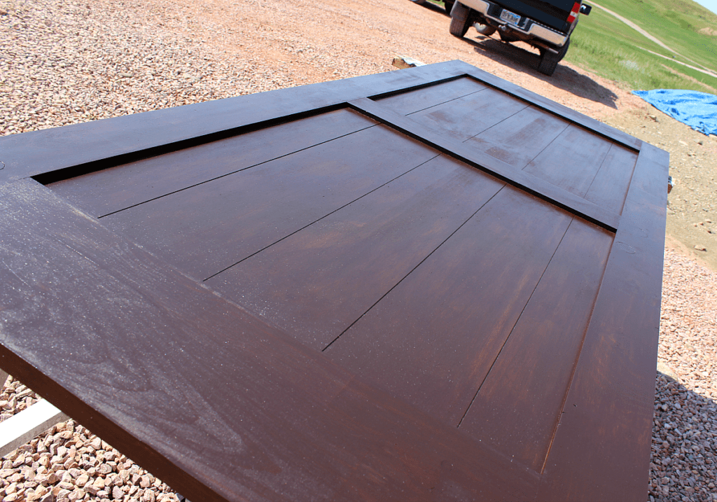 third coat of walnut colored gel stain on barn door : DIY Painted Barn Doors