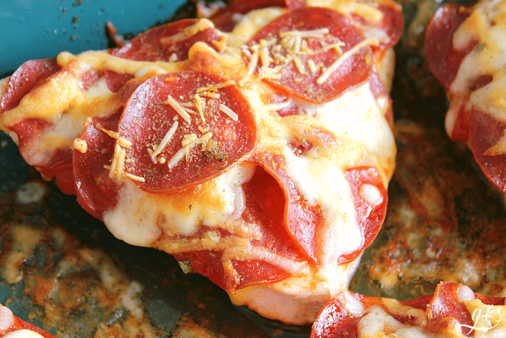Up close shot of Pizza Chicken with pepperoni and cheese atop a chicken breast.